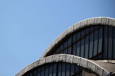 Low angle view of building against clear blue sky