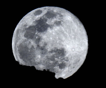 Scenic view of moon against sky at night