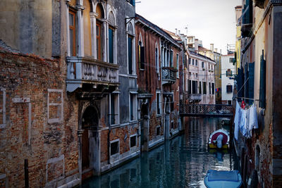 Canal amidst buildings in city