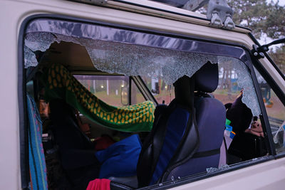 Rear view of people sitting in train