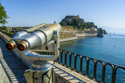 Close-up of cityscape against sea