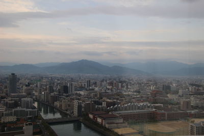 High angle view of buildings in city against sky