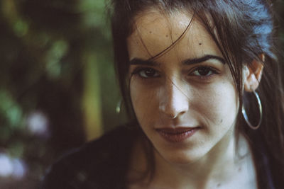 Close-up portrait of smiling young woman