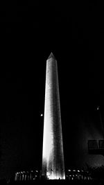 Low angle view of modern office building at night