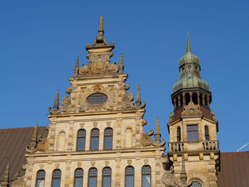 Low angle view of a building against blue sky