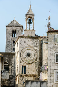 Low angle view of clock tower against sky