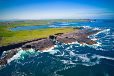 Aerial view of rocky shore and cliffs. 