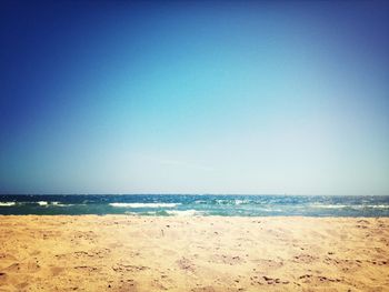 Scenic view of beach against clear sky