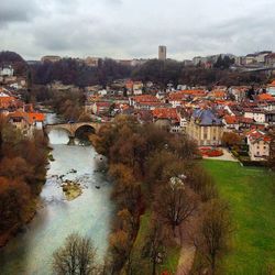 High angle view of river amidst buildings in town