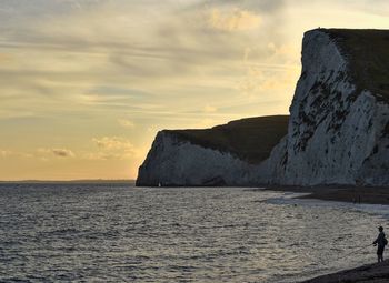 Scenic view of sea against sky at sunset