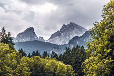 Scenic view of mountains against cloudy sky