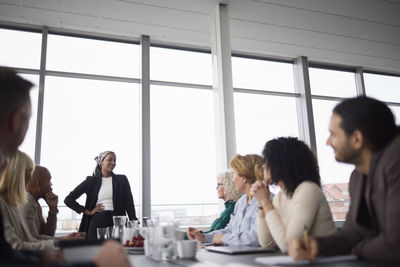 Woman talking during business meeting