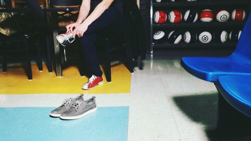 Low section of man standing on floor