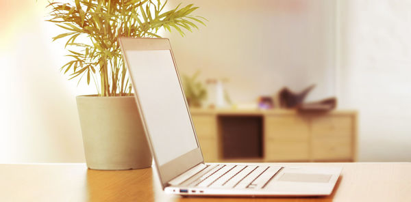Close-up of laptop on table at home