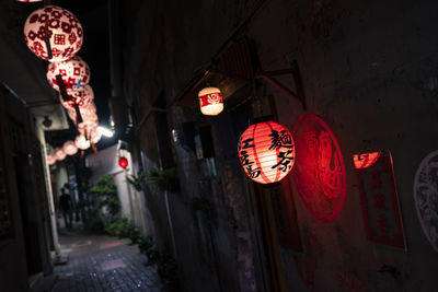 Illuminated lanterns hanging at night