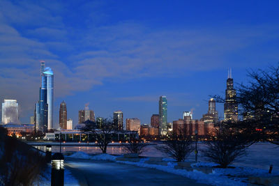 Big city skyline at dawn along the frozen waterfront