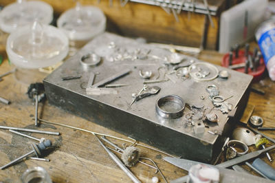 Jewelry making tools on workbench in workshop