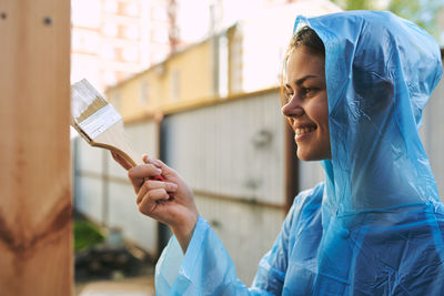 Midsection of woman holding ice cream