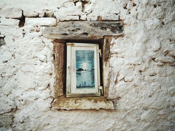 Low angle view of window on old building