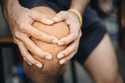 Close-up of woman holding hands