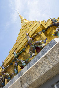 Low angle view of statue against sky