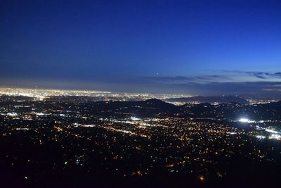 Aerial view of illuminated cityscape