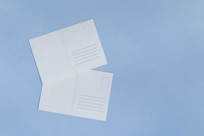 High angle view of white paper on table