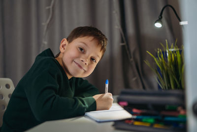 Boy using laptop at home