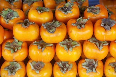 Full frame shot of orange fruits for sale at market stall