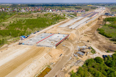 Aerial top view on city construction site. construction of new highway at suburb area