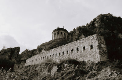 Low angle view of old building against sky