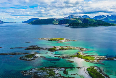 Aerial view of turquoise ocean, beaches, islands and mountains in northern norway