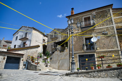 A narrow street between the old houses of marsicovetere, a village  of potenza province, italy.