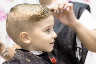 Close-up portrait of boy looking away