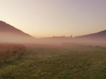 Scenic view of landscape against sky during sunset