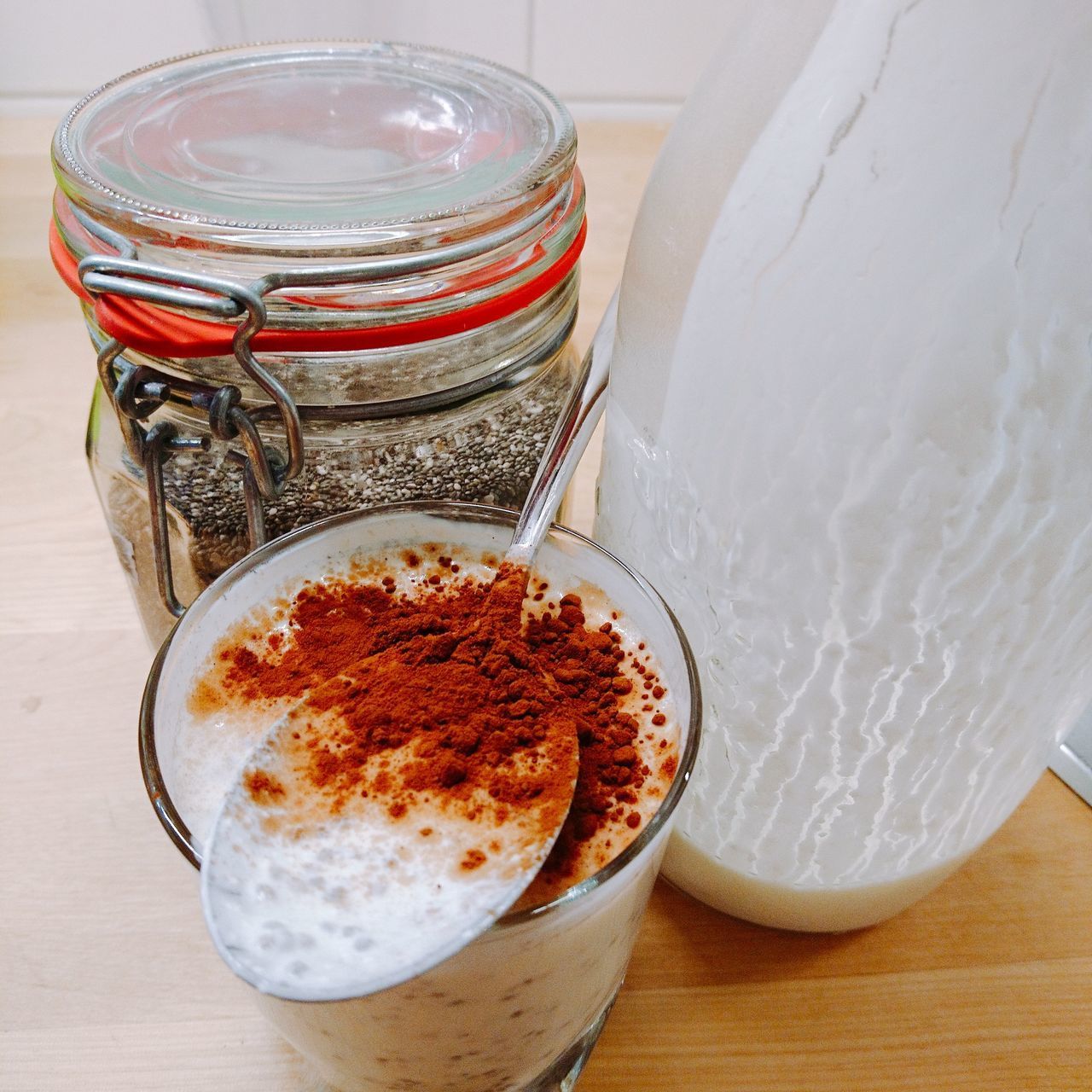 HIGH ANGLE VIEW OF COFFEE IN GLASS ON TABLE