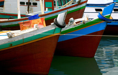 Boats moored at harbor