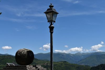 Low angle view of street light against sky