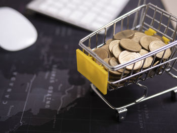 High angle view of coins on table