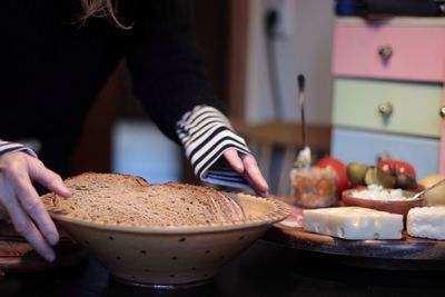Midsection of woman preparing food
