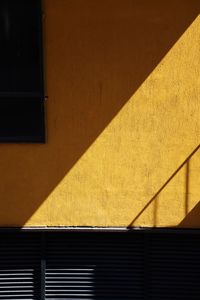 Shadow of railing on wall