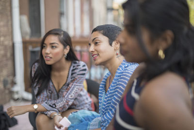 Young women talking at a party