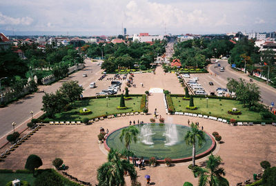 High angle view of fountain by trees in city