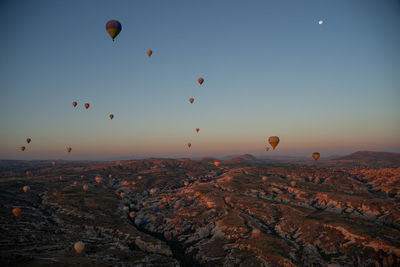 Hot air balloons flying against sky