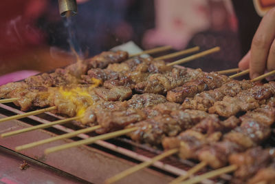 Close-up of meat on barbecue grill