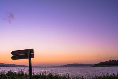 Scenic view of sea against clear sky during sunset