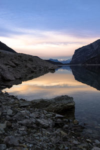 Scenic view of lake against sky during sunset