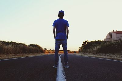 Woman walking on road