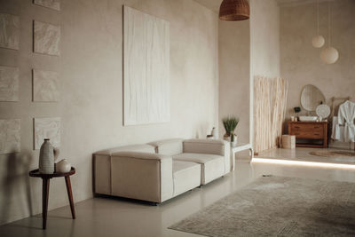 Luxury interior of big bathroom at modern african style with oval bathtub in natural lighting