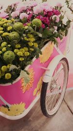 High angle view of pink flower pot on table